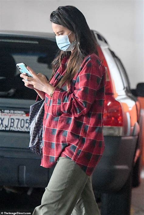 Pregnant Olivia Munn Covers Her Bump In A Flannel Amid Fan Speculation