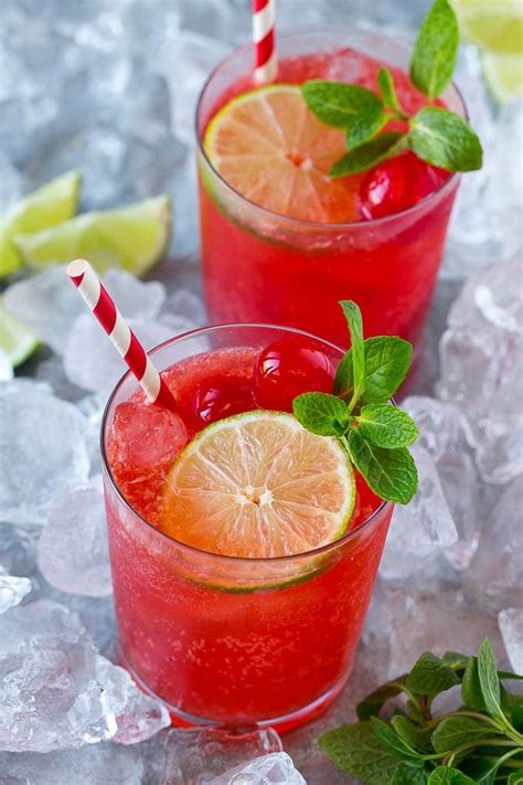 Cups Of Cherry Limeade Garnished With Mint Lime And Cherries Cherry