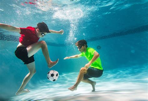 Kids Playing Underwater Soccer Stock Photo Download Image Now