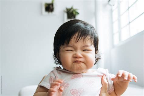 Baby Girl Making Funny Face By Stocksy Contributor Alita Stocksy