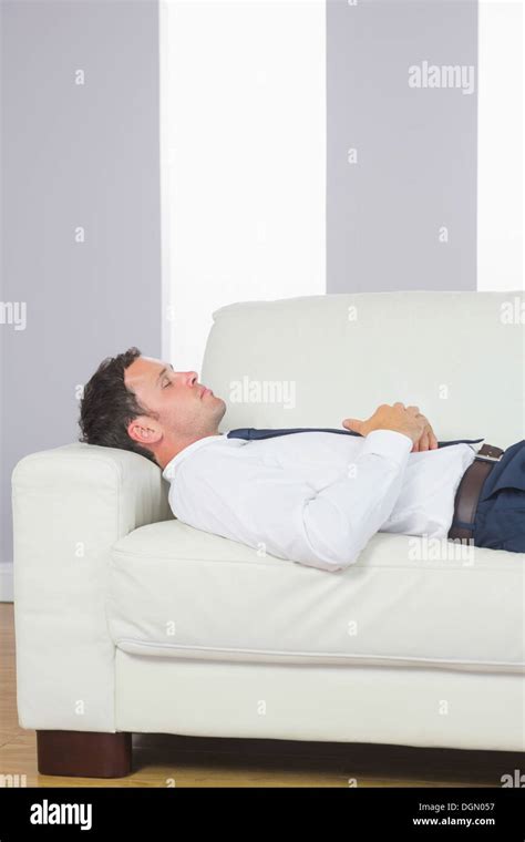 Peaceful Handsome Businessman Lying On Couch Stock Photo Alamy