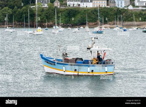 A Commercial Fishing Boat Leaving The Harbour At Douarnenez Brittany