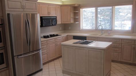 Before ripping out your current kitchen cabinets and getting into a complicated remodel project you may want to think about refacing, resurfacing, or refinishing your current cabinets. Before and After Kitchen and Lower Level Bar - Painterati