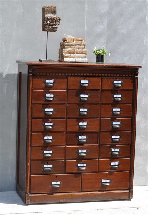 The pedestal features a smaller front. Multi Drawer Dark Wood Filing Cabinet - Home Barn Vintage