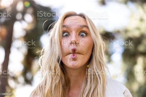 Blond Girl Making A Funny Kissy Face Stock Photo Download Image Now