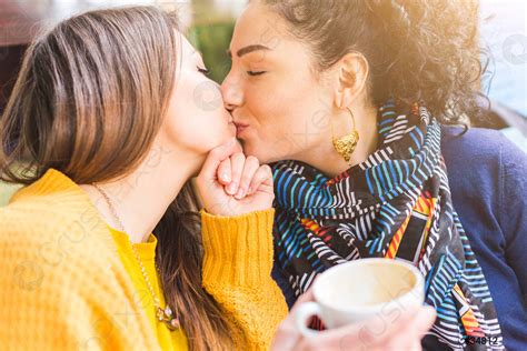 Lesbian Couple Kissing At A Cafe Stock Photo Crushpixel