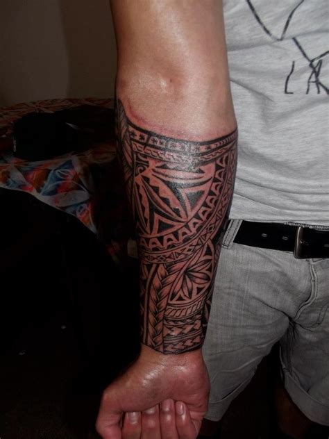 Want to see the world's best tribal forearm tattoo ideas? Cool tribal sleeve tattoo for men on forearm ...