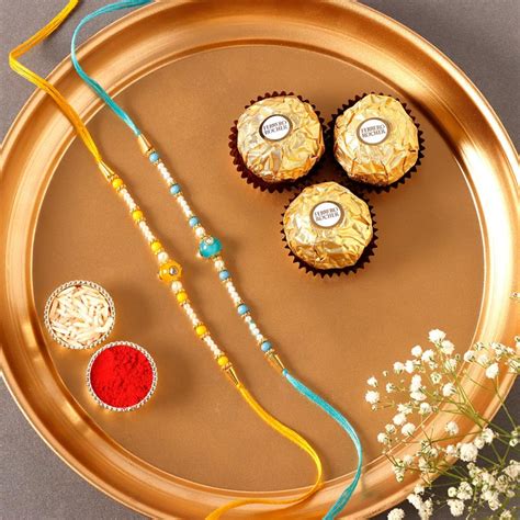 Send Sneh Vibrant Set Of 2 Pearl Rakhis Ferrero Rocher Online