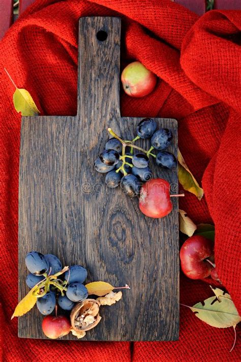 Autumn Seasonal Food Ingredients Fruits On A Cutting Wooden Board