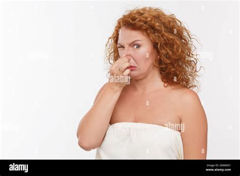 Mature Woman Holding Her Nose Stock Photo Alamy