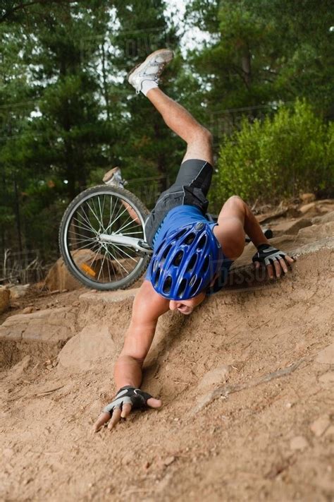 Man Falling Off Mountain Bike Stock Photo Dissolve