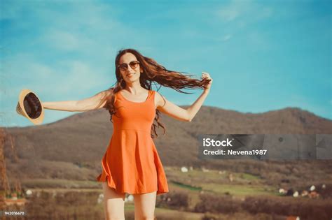 A Beautiful Woman Walking Around A Mountainside Stock Photo Download
