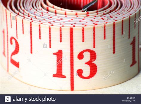 A White Rolled Measuring Tape Showing Centimeters Stock Photo Alamy