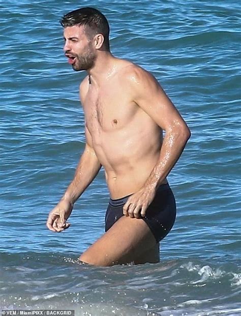 Shakira Bundles Up While Footballer Beau Gerard Pique Strips Down For A Christmas Eve Swim In