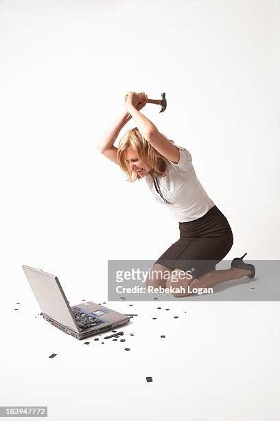Woman Smashing Computer Photos And Premium High Res Pictures Getty Images