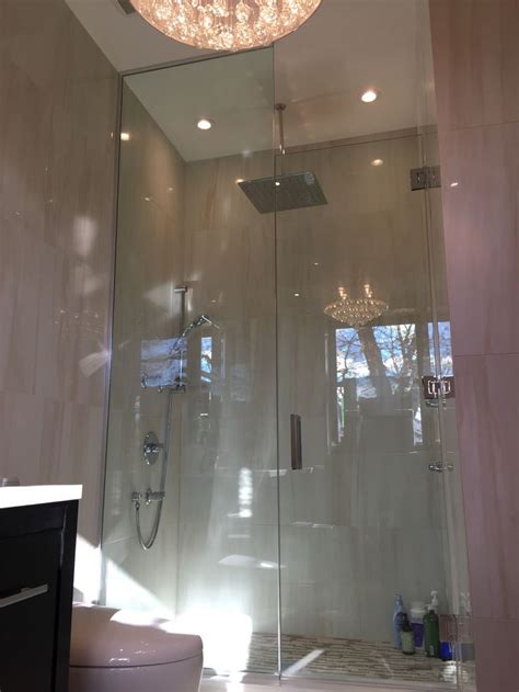 Luxurious Chandelier Compliment The Elegance Of This Glass Shower