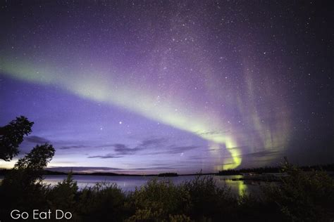 The Northern Lights In The Night Sky Above Lake Egenolf In Northern