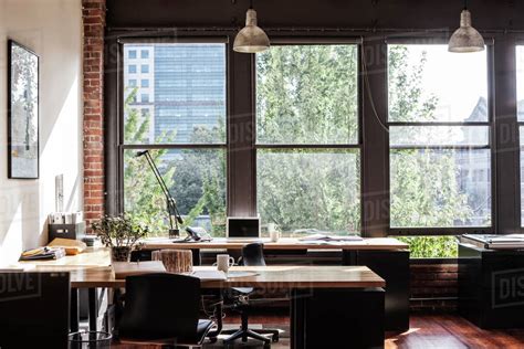 Creative Office Interior View Through A Window To Trees And City