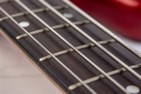 Closeup Of Bass Guitar Neck With Strings Creative Commons Bilder