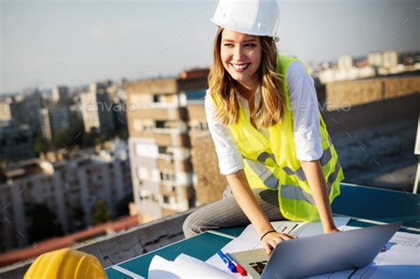 Portrait Of Engineer Architect Young Woman Working On Construction