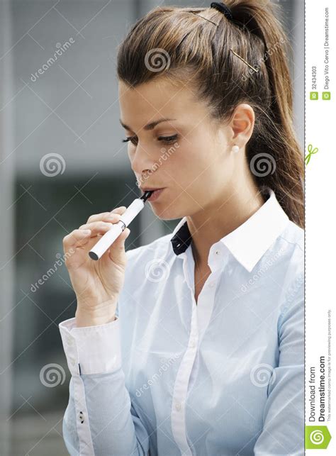 Young Woman Smoking Electronic Cigarette Outdoor Office Building Stock