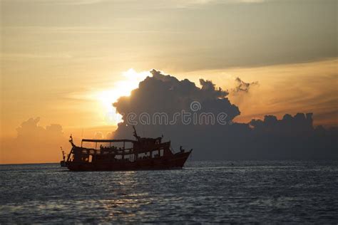 Tourist Boat Cruising Against Beautiful Sunset Sky Stock Photo Image