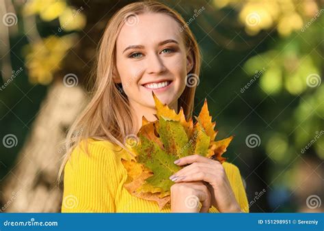 Beautiful Young Woman With Autumn Leaves In Park Stock Image Image Of