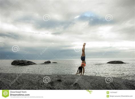 Woman Doing A Handstand On A Rock At Sunset On Bakovern Beach Cape Town Stock Image Image Of