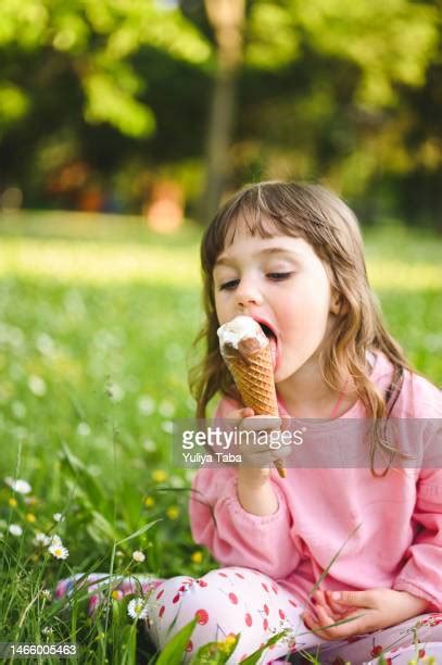 girl eating messy ice cream cone photos and premium high res pictures getty images