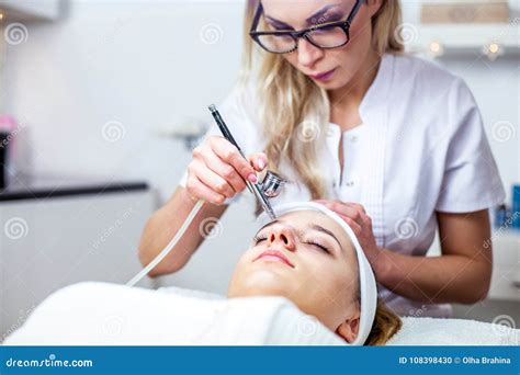 Women In Cosmetology Cabinet Cosmetologist Is Doing Procedure For