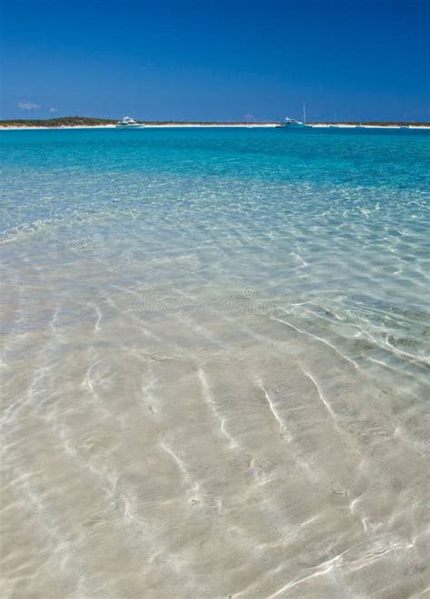 Bahamas Beach Scene With Crystal Clear Water And Sand Ripples Stock