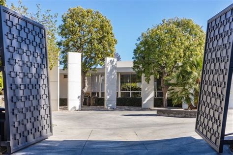 The houses and guest houses are situated on more than three acres, and the grounds include a this spring, seacrest put his gated hollywood hills compound on the market for $11.985 million; Look inside Ellen Degeneres's $33m Beverly Hills mansion | HouseAndHome.ie