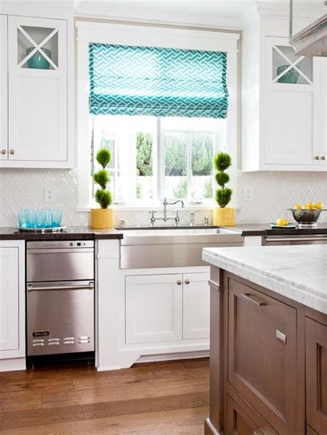 Lovely kitchen with white beadboard cabinets paired with white countertops and a turquoise herringbone tile backsplash.a kitchen sink stands under turquoise kitchen features a beadboard ceiling lined with a pair of sloane single pendants illuminating center island lined with turquoise. How My Mind Wanders {Yellow, Turquoise & White Kitchen ...