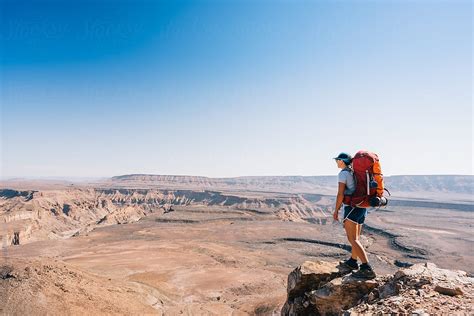 Hiker Hiking In The Desert By Stocksy Contributor Juno Stocksy