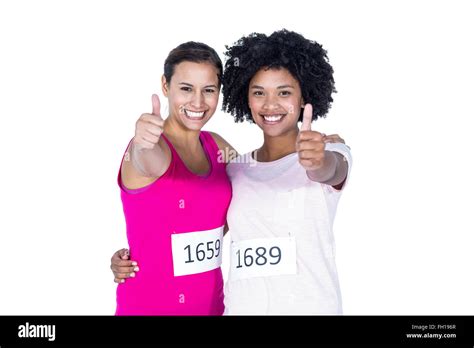 Portrait Of Happy Female Athletes With Thumbs Up Stock Photo Alamy