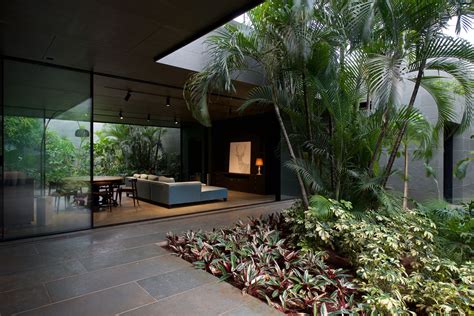 Open Air Living Space Surrounded With Courtyard Gardens In A Stone Clad
