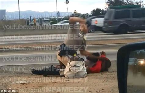 trooper is filmed beating woman in the head on the side of california highway daily mail online