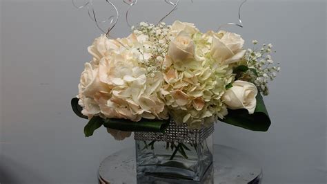 how to make a centerpiece with hydrangeas and roses in a cube vase wedding floral centerpieces