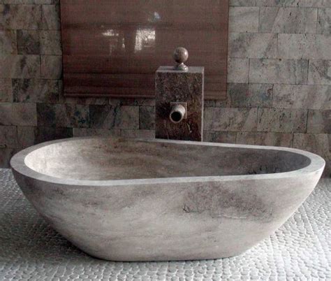 Porcelain bathtubs are made from steel sheets and feature a porcelain enamel coating. 20 Bathroom Designs With Stunning Stone Tubs