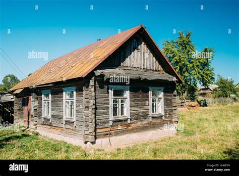 Old Russian Traditional Wooden House In Village Or Countryside Of
