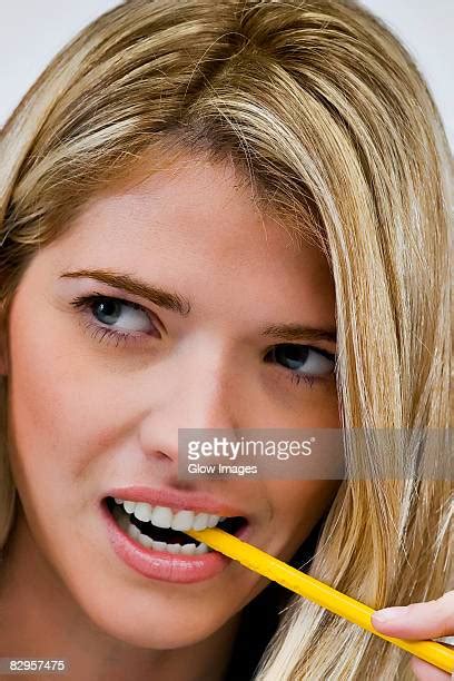 Woman Chewing On Pencil Photos And Premium High Res Pictures Getty Images