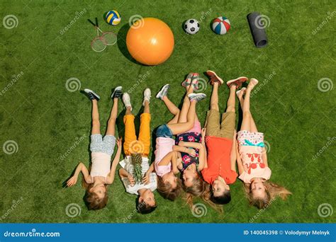 Group Of Happy Children Playing Outdoors Stock Photo Image Of Female