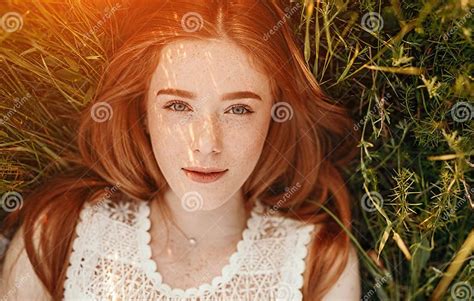 Positive Ginger Girl Lying On Grass Stock Image Image Of Overhead