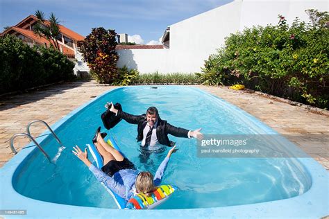 Business Dressed Couple In Swimming Pool Photo Getty Images