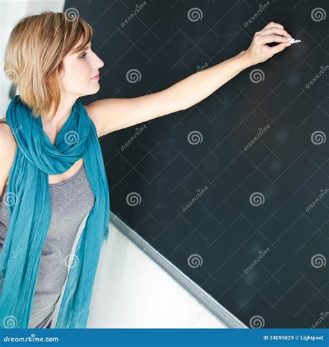 Young Student Writing On The Blackboard Royalty Free Stock Images
