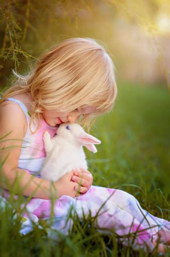 Cute Little Girl With A Bunny Rabbit Has A Easter Stock