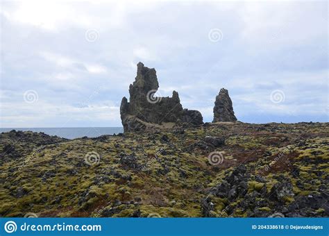 View Of Londrangar Rock Formation Along Iceland S Coast Stock Photo