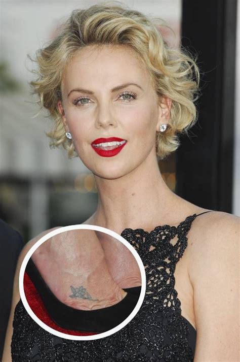 Celebrities With Flower Tattoos Photos Celebrities Charlize Theron Flower Tattoos