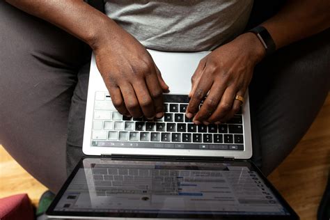 Man Typing On His Laptop · Free Stock Photo