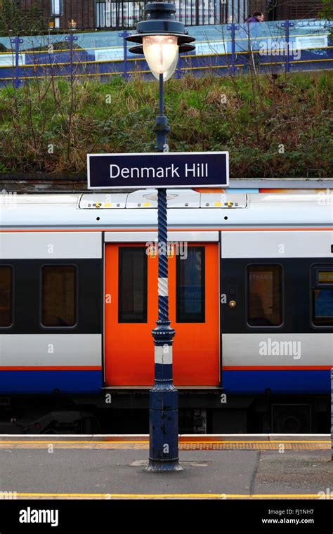 London Overground Train And Denmark Hill Railway Station Sign